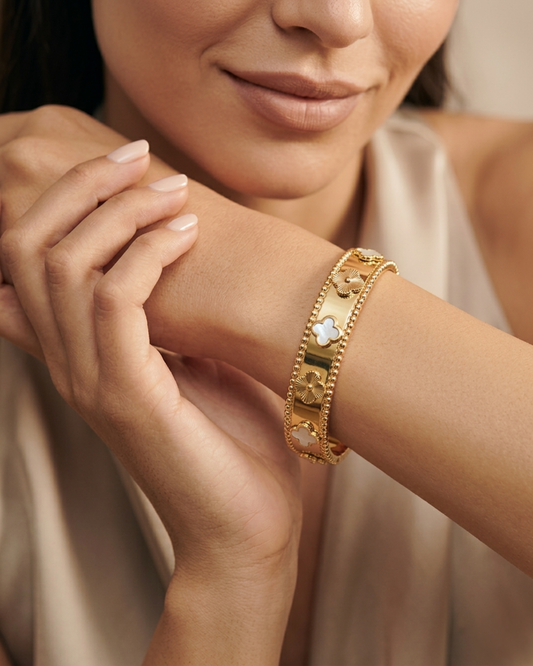 Maestra Lumina Bloom 18k gold-plated floral clover bangle, luxury demi-fine jewelry for women.