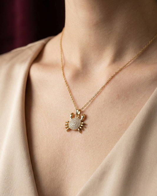 Maestra Caria 18k gold-plated crab pendant necklace, unique zodiac-inspired beach jewelry, waterproof and sweat-proof.
