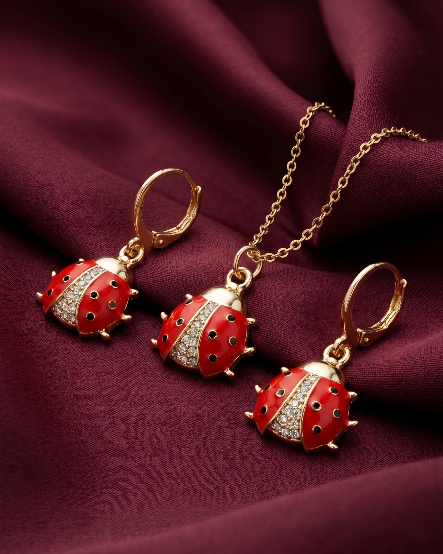 Gold plated ladybug necklace and earrings set for women. 3 piece matching red enamel insect jewelry combo India. Lightweight office wear necklace and earring sets for working women. Crystal studded ladybug pendant and drop earrings alloy. Diwali, Navratri, and Rakhi jewelry gifts for wives. Gold tone festive neck and ear accessories for girls, women, and friends