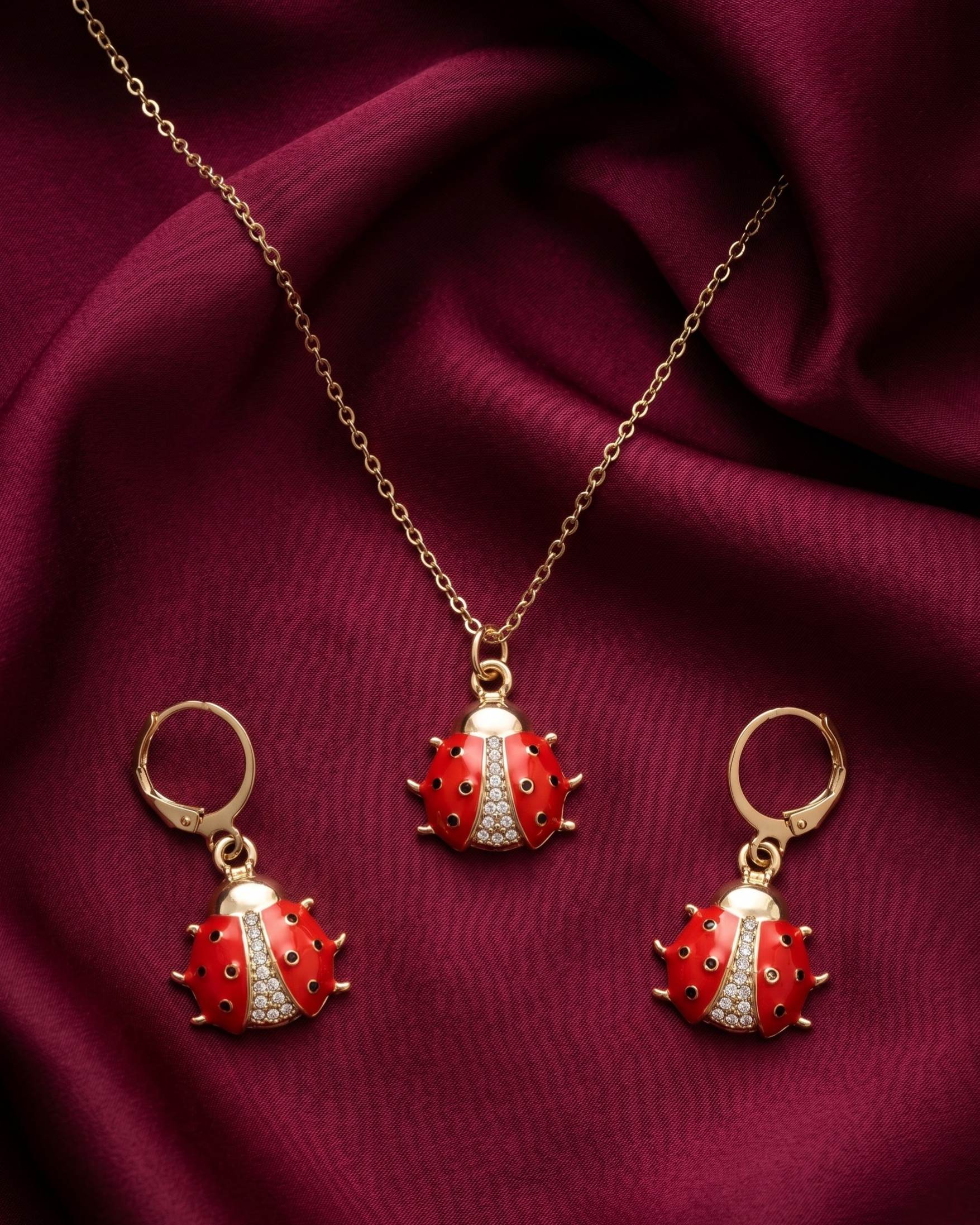 Gold plated ladybug necklace and earrings set for women. 3 piece matching red enamel insect jewelry combo India. Lightweight office wear necklace and earring sets for working women. Crystal studded ladybug pendant and drop earrings alloy. Diwali, Navratri, and Rakhi jewelry gifts for wives. Gold tone festive neck and ear accessories for girls, women, and friends