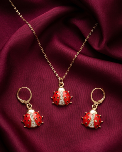 Gold plated ladybug necklace and earrings set for women. 3 piece matching red enamel insect jewelry combo India. Lightweight office wear necklace and earring sets for working women. Crystal studded ladybug pendant and drop earrings alloy. Diwali, Navratri, and Rakhi jewelry gifts for wives. Gold tone festive neck and ear accessories for girls, women, and friends
