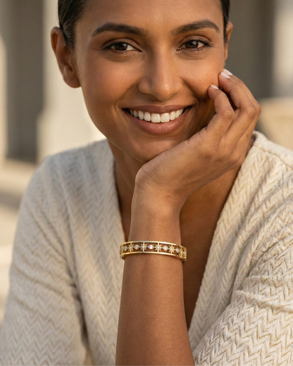 Maestra Celestial Starburst 18k gold-plated bangle, radiant star motif waterproof jewelry for daily glow.