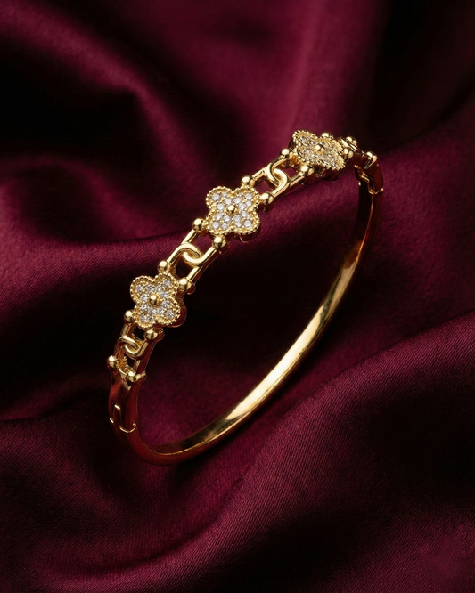 Maestra Fortuna 18k gold-plated clover bangle, lucky charm waterproof demi-fine jewelry staple.