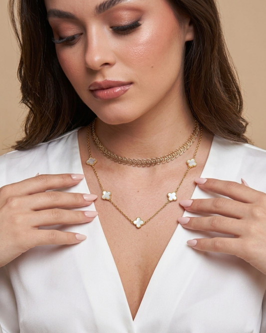 Maestra Hera white clover layered necklace stack, 18k gold-plated waterproof clover and laurel leaf chain set.