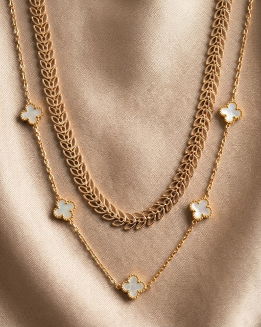 Maestra Hera white clover layered necklace stack, 18k gold-plated waterproof clover and laurel leaf chain set.