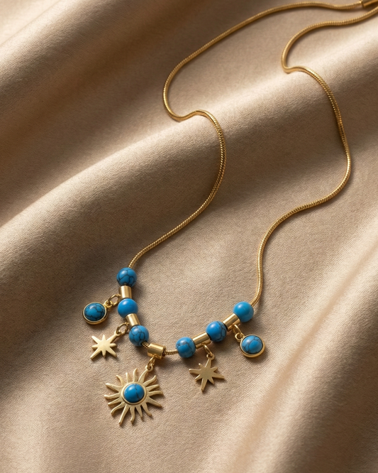Maestra 18k gold-plated turquoise celestial charm necklace with moon and star, waterproof boho-luxe jewelry.
