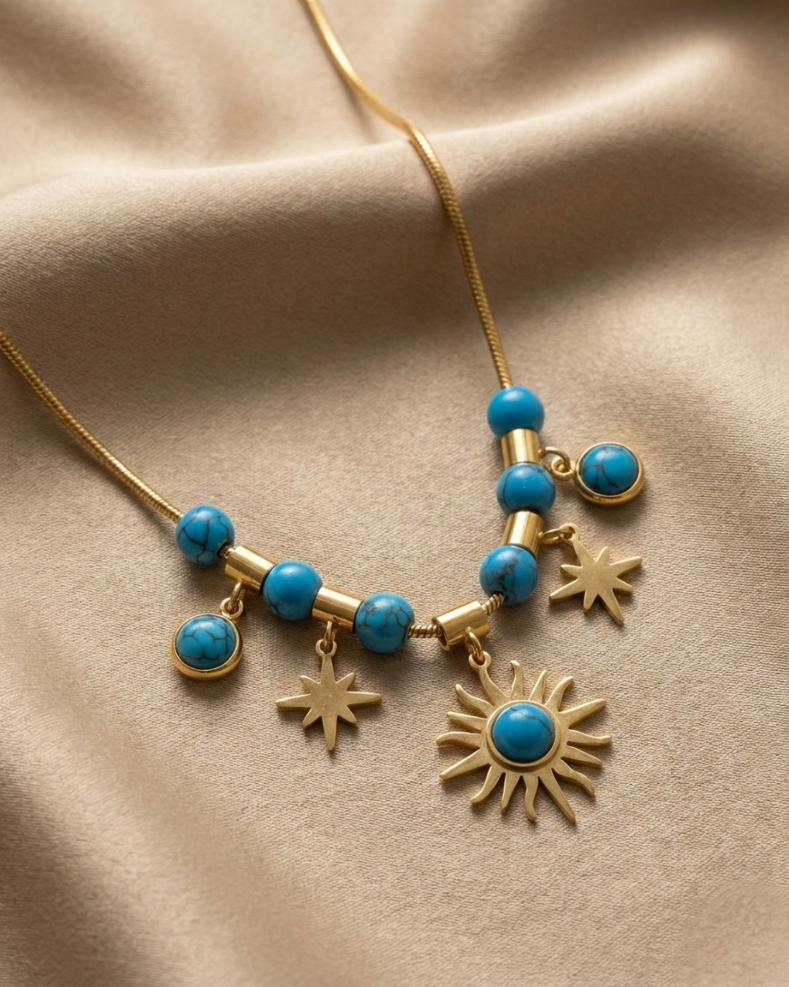 Maestra 18k gold-plated turquoise celestial charm necklace with moon and star, waterproof boho-luxe jewelry.
