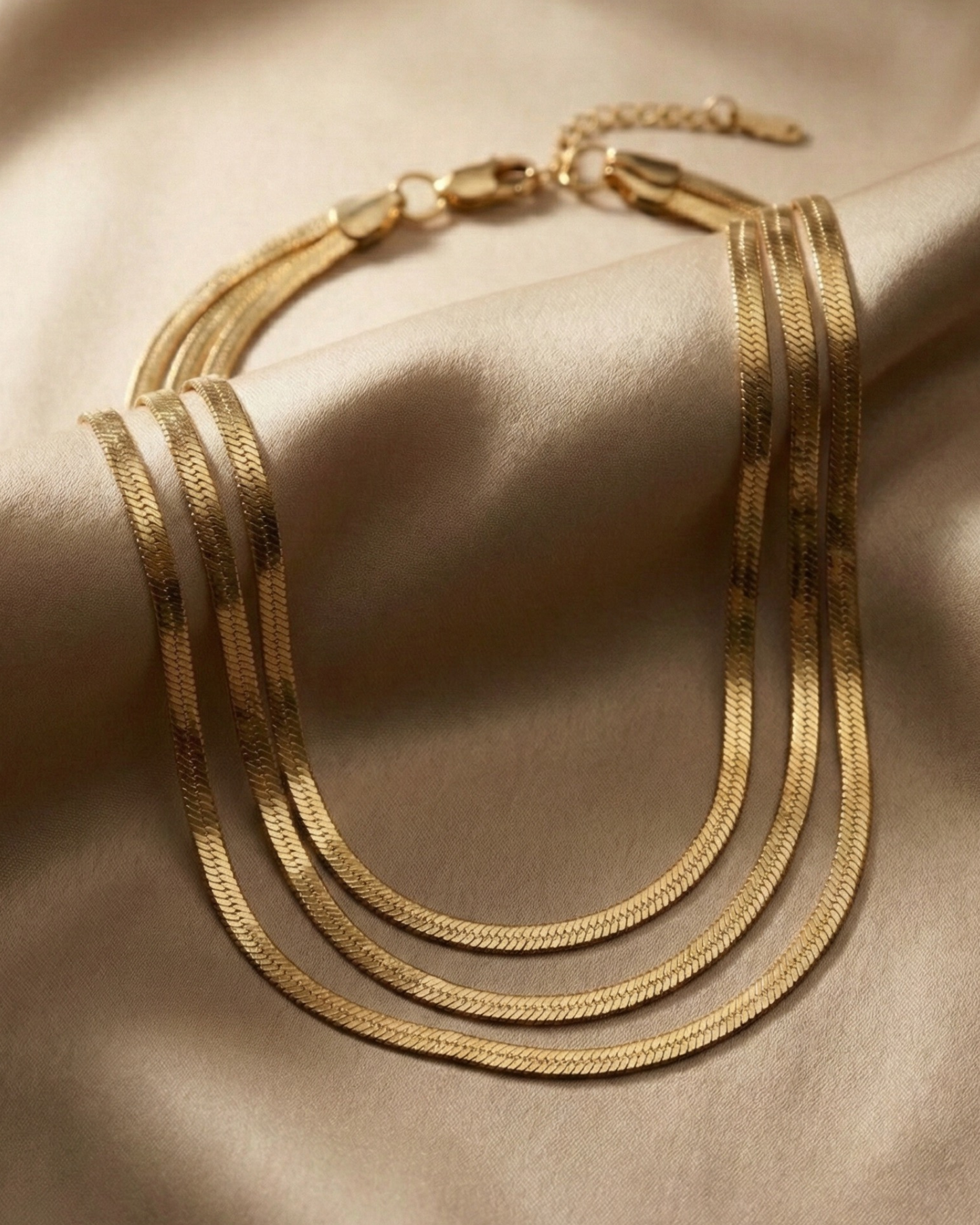 Maestra Trinity 18k gold-plated snake chain necklace, minimalist waterproof flat link chain for layering.