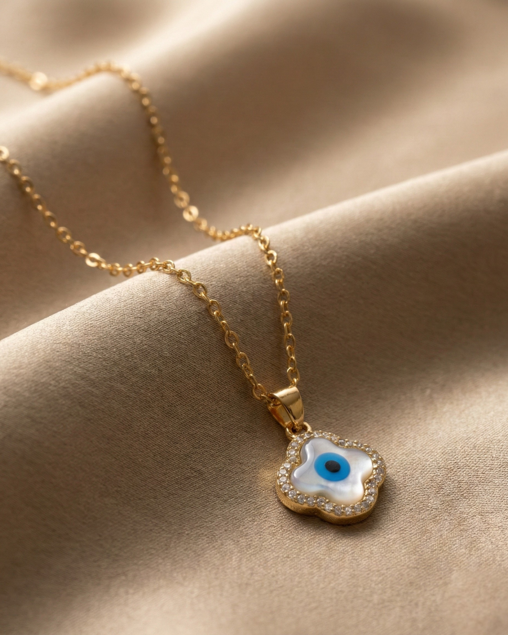 Maestra Gia 18k gold-plated evil eye clover necklace, protective demi-fine jewelry, waterproof and tarnish-free.