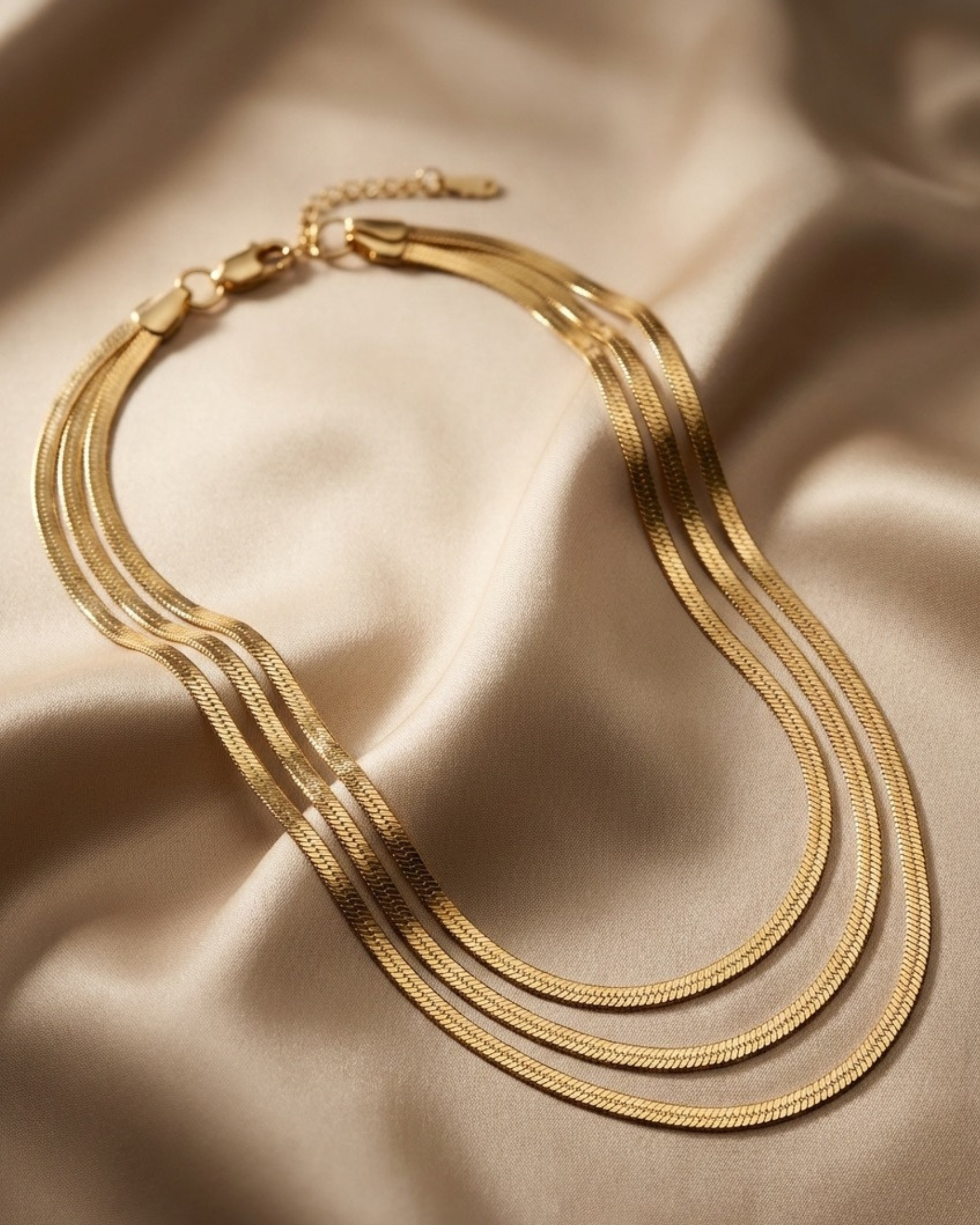 Maestra Trinity 18k gold-plated snake chain necklace, minimalist waterproof flat link chain for layering.