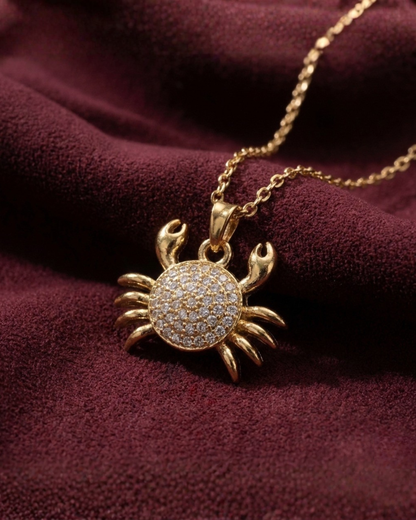 Maestra Caria 18k gold-plated crab pendant necklace, unique zodiac-inspired beach jewelry, waterproof and sweat-proof.