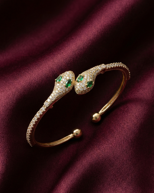 Maestra Medusa 18k gold-plated serpent cuff, bold animal-motif waterproof demi-fine jewelry.