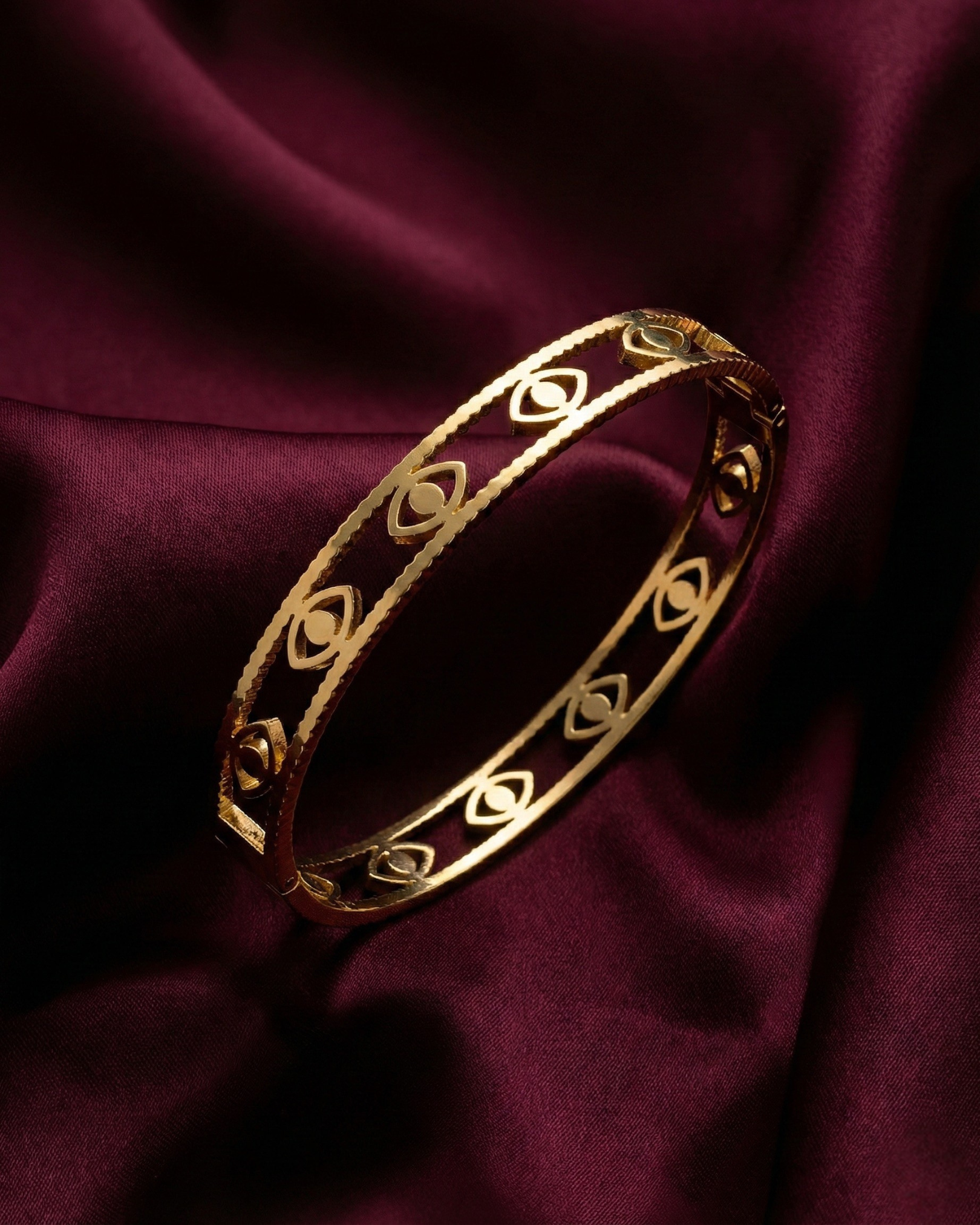Maestra Mini Iris 18k gold-plated evil eye bangle, minimalist waterproof protection jewelry for stacking.