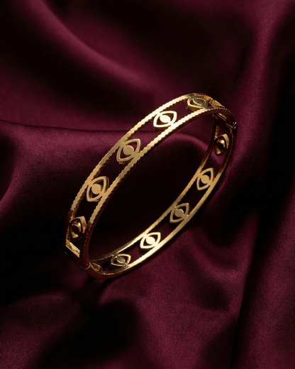 Maestra Mini Iris 18k gold-plated evil eye bangle, minimalist waterproof protection jewelry for stacking.