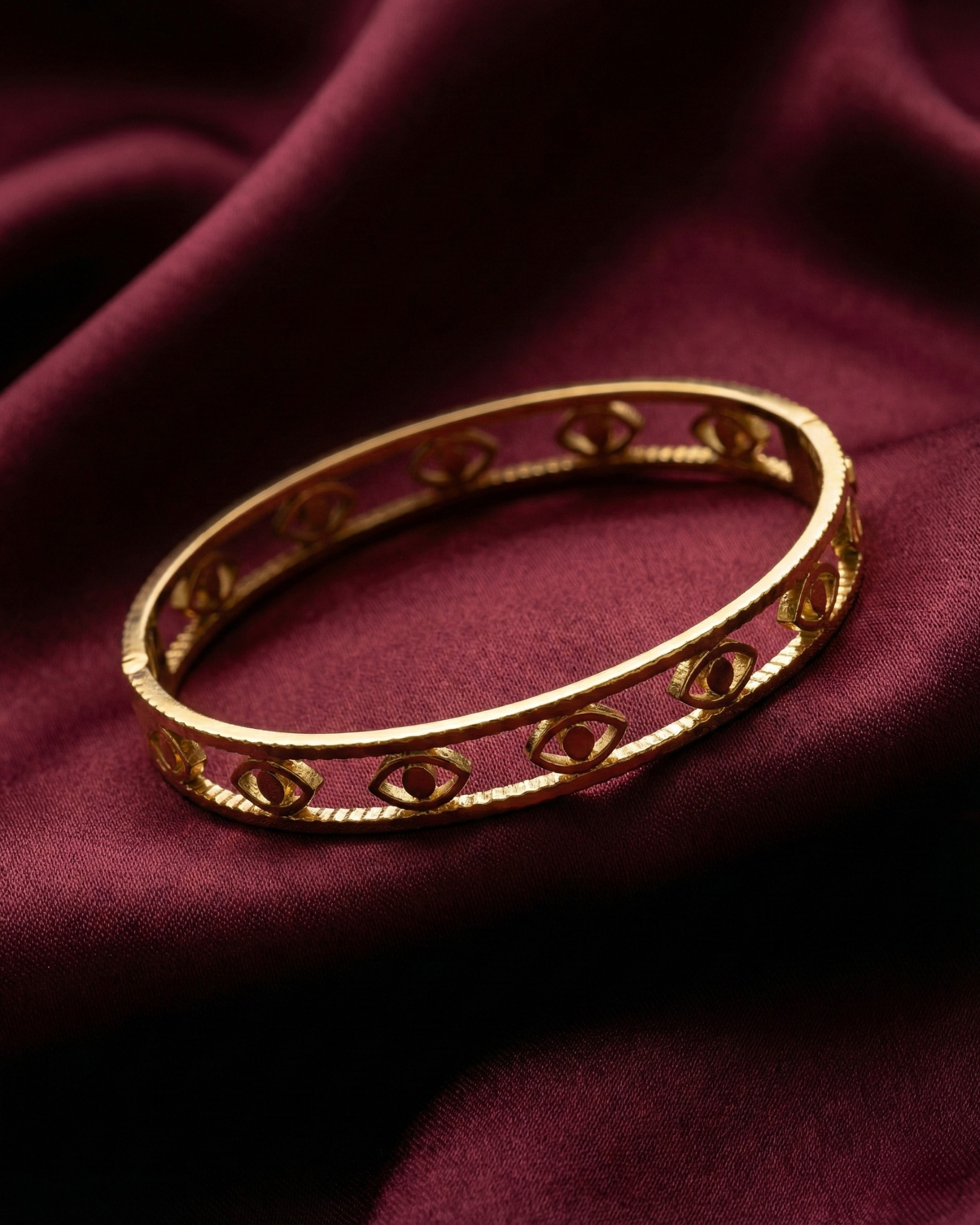Maestra Mini Iris 18k gold-plated evil eye bangle, minimalist waterproof protection jewelry for stacking.