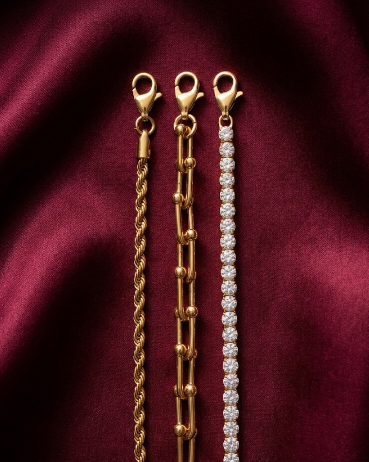 Maestra Nexus Interlock 18k gold-plated tennis bracelet stack, layered waterproof luxury chic jewelry.