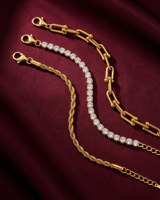 Maestra Nexus Interlock 18k gold-plated tennis bracelet stack, layered waterproof luxury chic jewelry.