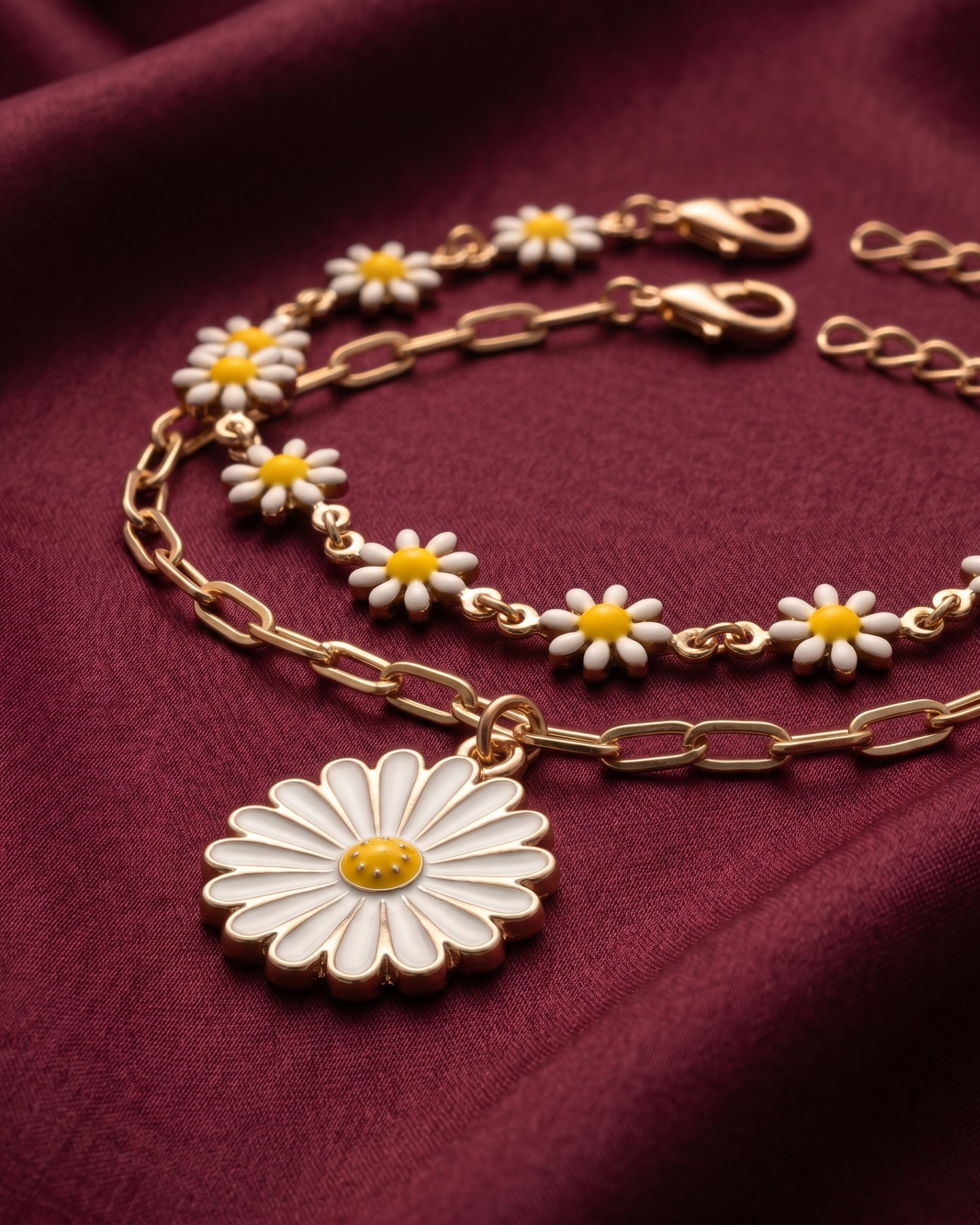Gold plated daisy charm bracelet stack for women. 2 piece layered flower link bracelets India. Lightweight office wear jewelry for working women. Enamel daisy and paperclip chain bracelet set alloy. Diwali and Rakhi jewelry gifts for wives. Gold tone festive wrist accessories for girls and friends.