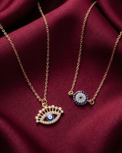 Gold plated evil eye lash necklace set for women. 2 piece layered protective pendant jewelry India. Lightweight office wear necklaces for working women. Crystal studded eye lash and circular charm necklace alloy. Diwali, Navratri, and Rakhi jewelry gifts for wives. Gold tone festive neck accessories for girls, women, and friends