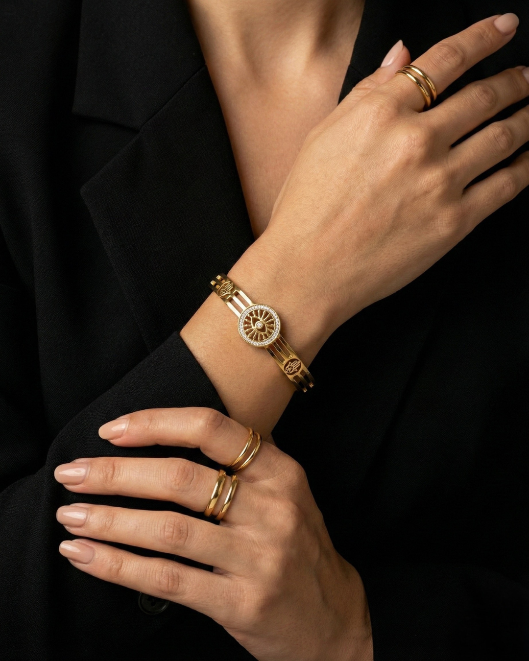 Maestra Sentinel 18k gold-plated evil eye and hamsa bangle, protective waterproof jewelry with symbolic charms.