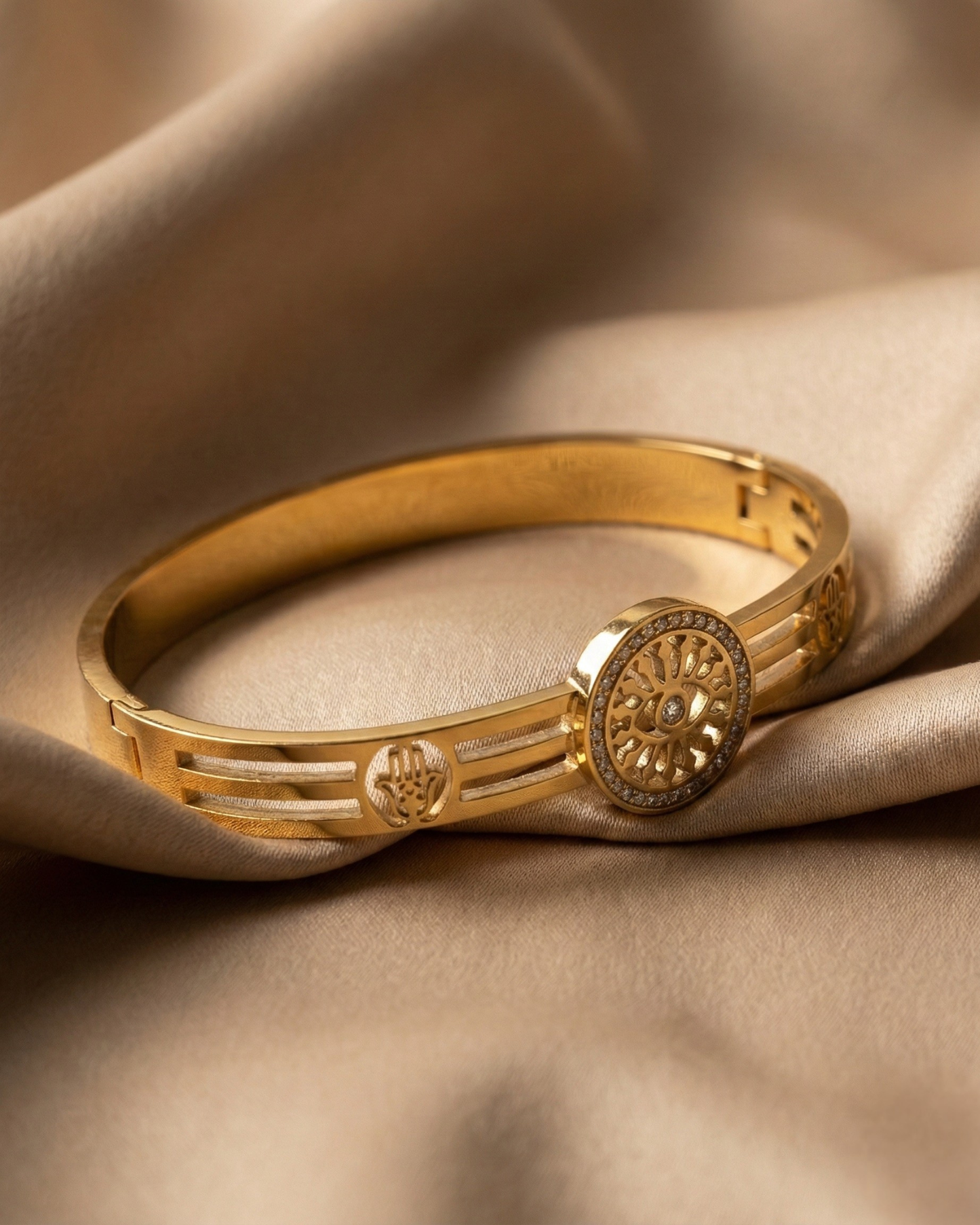 Maestra Sentinel 18k gold-plated evil eye and hamsa bangle, protective waterproof jewelry with symbolic charms.