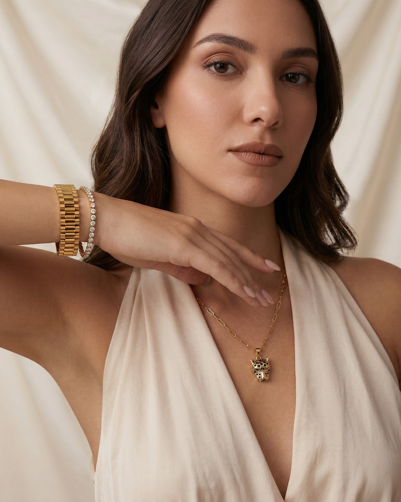 Woman wearing Maestra's Panthera animal necklace, Regalia Watchlink Bracelet, Diana American Diamond Tennis Bracelet.