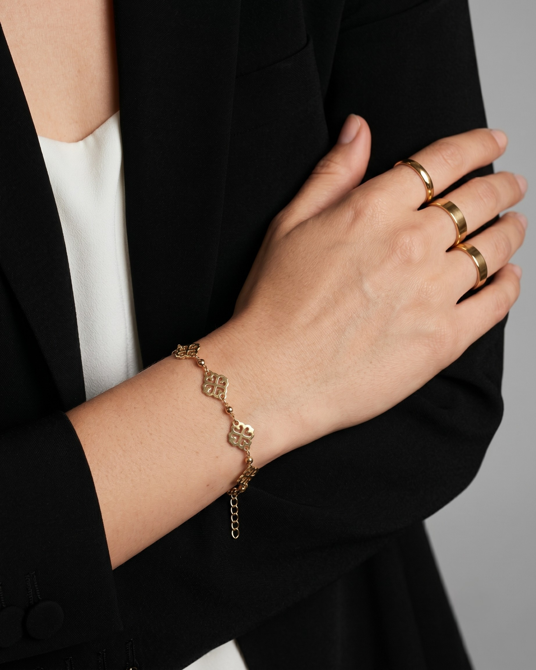 Gold plated floral mandala chain bracelet for women. Geometric filigree charm bracelets India. Lightweight office wear jewelry for working women. Traditional motif station bracelet alloy. Diwali and Rakhi jewelry gifts for wives. Gold tone festive wrist accessories for girls and friends.