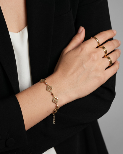 Gold plated floral mandala chain bracelet for women. Geometric filigree charm bracelets India. Lightweight office wear jewelry for working women. Traditional motif station bracelet alloy. Diwali and Rakhi jewelry gifts for wives. Gold tone festive wrist accessories for girls and friends.