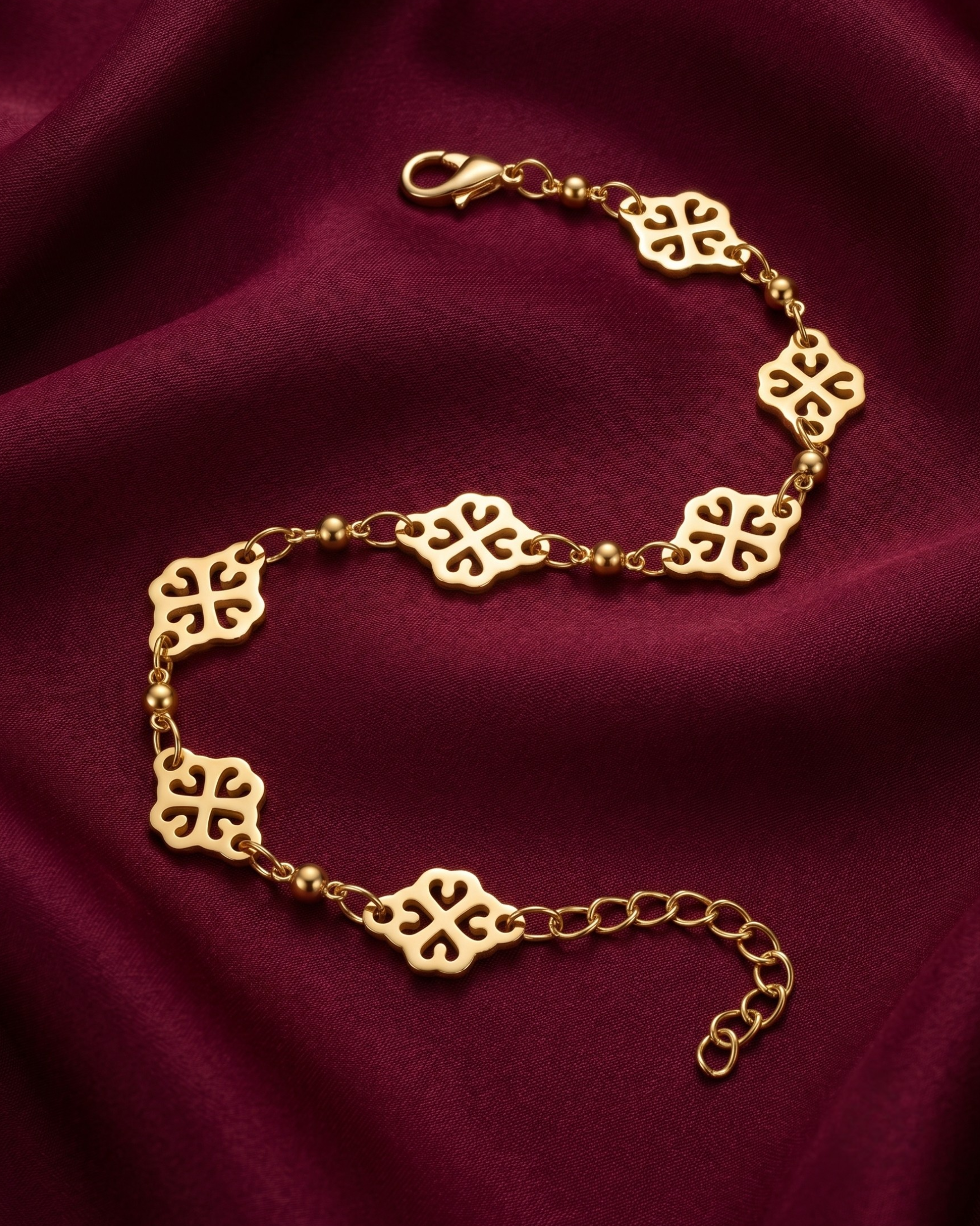 Gold plated floral mandala chain bracelet for women. Geometric filigree charm bracelets India. Lightweight office wear jewelry for working women. Traditional motif station bracelet alloy. Diwali and Rakhi jewelry gifts for wives. Gold tone festive wrist accessories for girls and friends.