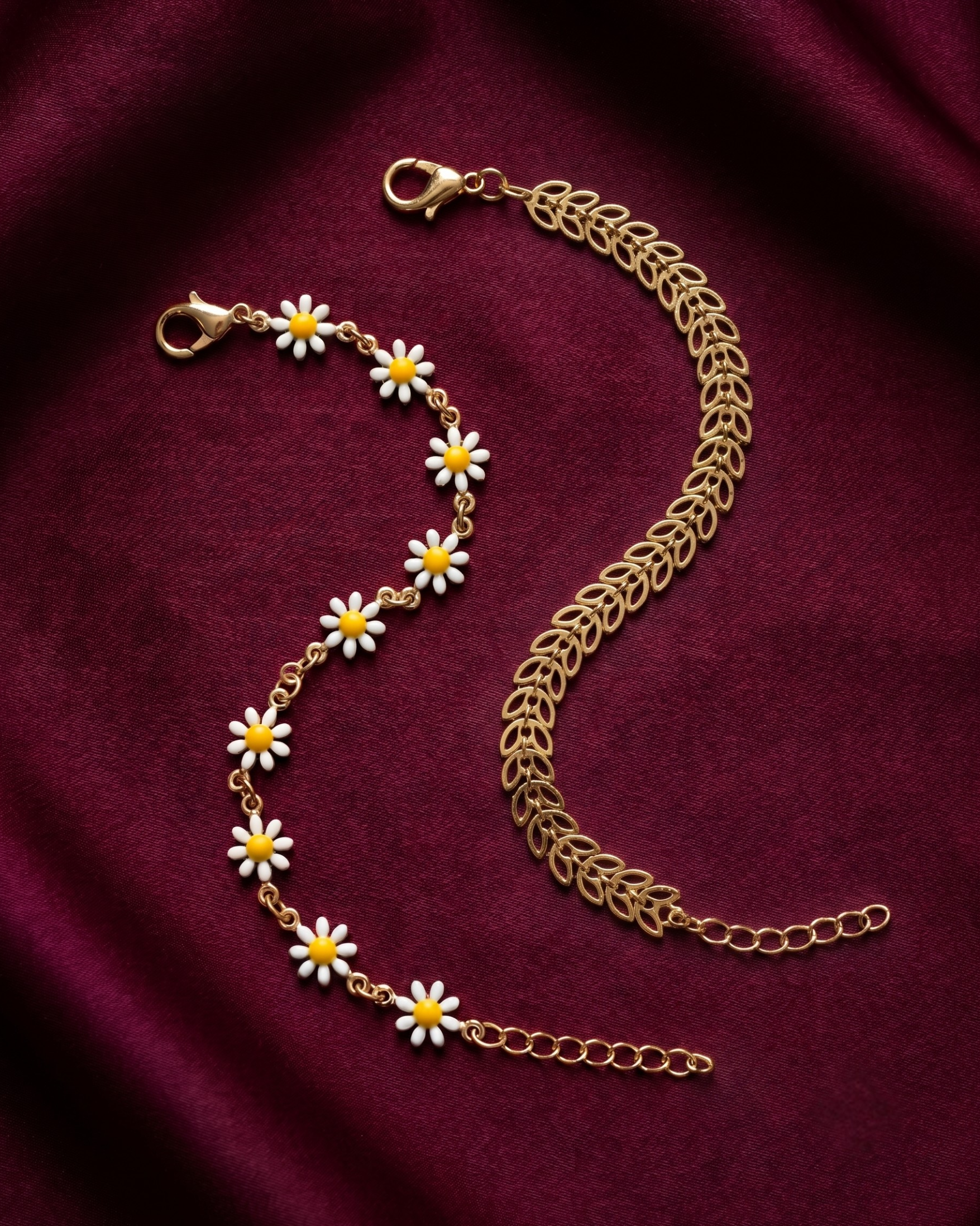 Gold plated daisy and leaf bracelet stack for women. 2 piece layered botanical link bracelets India. Lightweight office wear jewelry for working women. Enamel flower and chevron charm bracelet set alloy. Diwali and Rakhi jewelry gifts for wives. Gold tone festive wrist accessories for girls and friends.