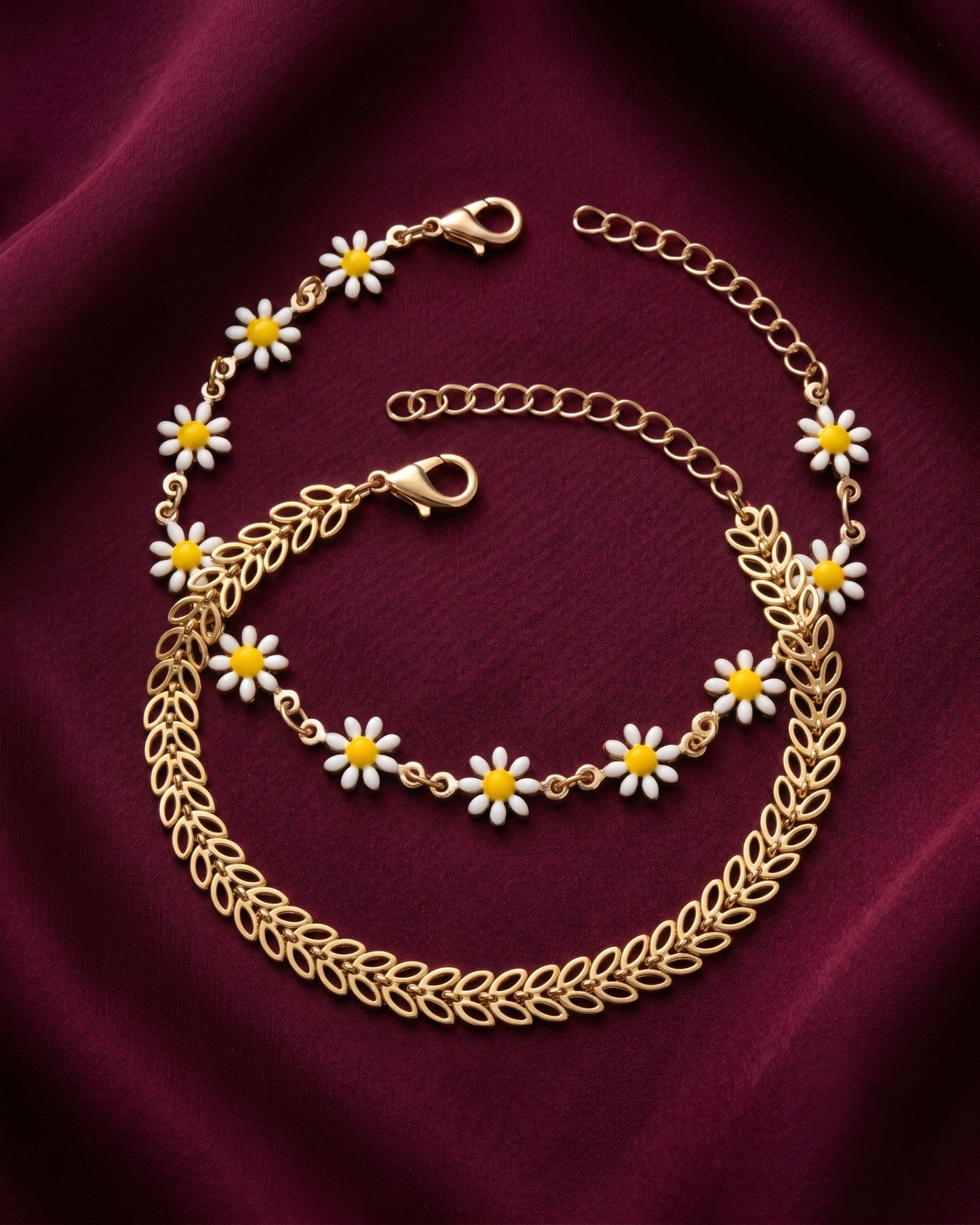 Gold plated daisy and leaf bracelet stack for women. 2 piece layered botanical link bracelets India. Lightweight office wear jewelry for working women. Enamel flower and chevron charm bracelet set alloy. Diwali and Rakhi jewelry gifts for wives. Gold tone festive wrist accessories for girls and friends.